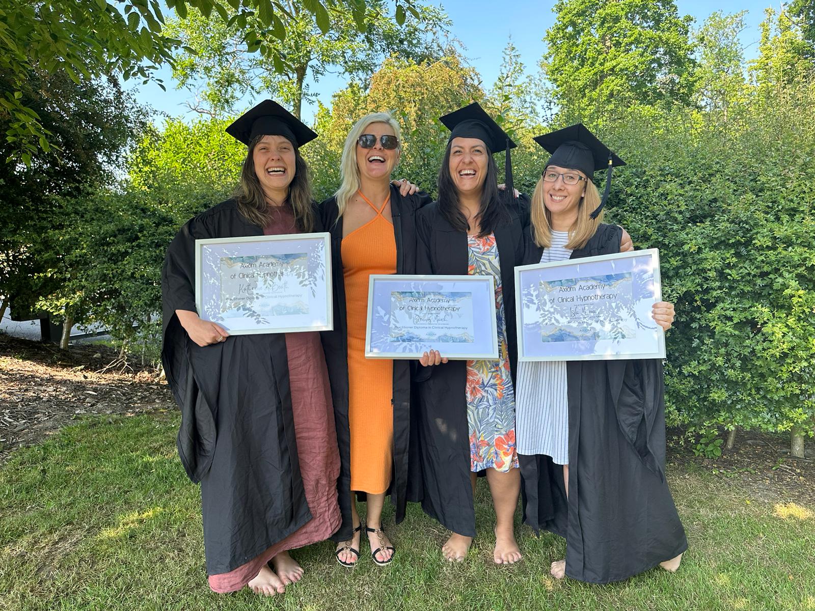 hypnotherapy students graduating holding certificates